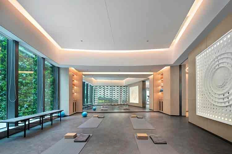 Bright yoga and mat Pilates studio full room